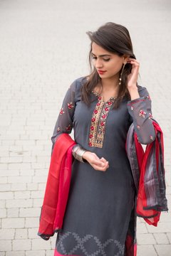 Portrait of an Indian young girl. Girl in traditional Indian clothing, salwar kameez. Girl traditional Indian decorations, bindi, chudiyan, jumka