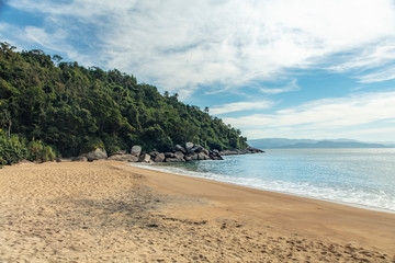 Beautiful view of Jabaquara beach in Ilhabela on tropical island on the Brazilian sea coast during a sunny day of vacation and sightseeing trip.