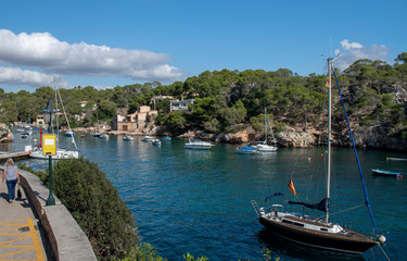 Cala Figuera Majorca, view of this natural inlet and traditional village which retains an atmosphere of a working fishing port. White-painted houses are perched on the hillside close to the water.
