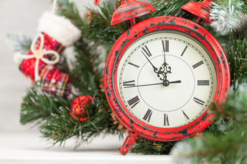 Fototapeta na wymiar Christmas card with decorated fir tree and clock