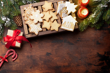 Christmas card with gingerbread cookies and fir tree