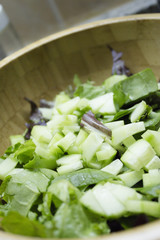 Bamboo bowl with green salad