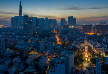 Five o'clock, early morning aerial urban view binh thanh district of Ho Chi Minh City featuring a french colonial church, streets and high rise buildings and majestic sky
