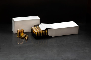 Bullet isolated on black background with reflexion. Rifle bullets close-up on black back....