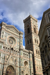 Fototapeta premium Detail of the facade of the Basilica di Santa Maria del Fiore (Florence Cathedral or Cathedral of Saint Mary of the flower), the main church of Florence, Italy. Bottom view.