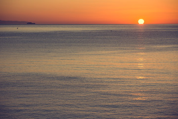 The sun rises over the sea, dawn in Sicily