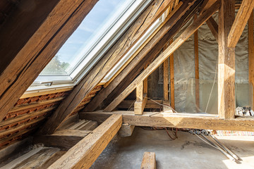 roof building site: new windows in old roof framework - 299068707