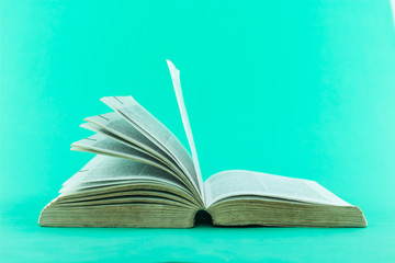 open book on green background.