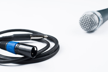 Microphone with cable isolated on white background.Copy space.