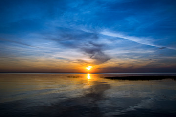 Fototapeta na wymiar Beautiful colorful sunset under sea