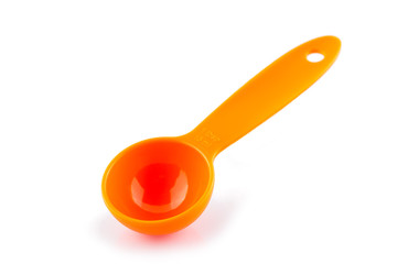 measuring spoon of plastic on white background.