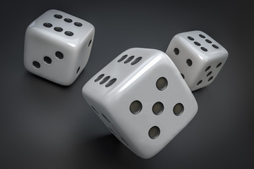 Set of white dice with black dots isolated on black background