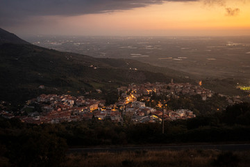 view of italian town from the hill at sunset