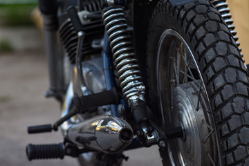 rear wheel of motorcycle with spring and shock absorber.