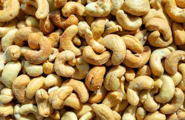 Background made of cashew nuts. Healthy snack and food. Salted roasted cashew. Top view. Nuts. Cashew. 