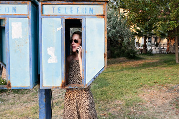 Woman on a pay phone in Turkey