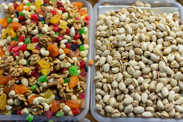 dried fruits, nuts (pistachios) and candied fruits on the market