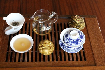Chinese tea ceremony using tea utensils made of glass, clay and porcelain.