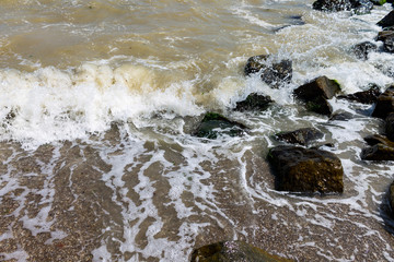 Sea seaside with stones, Waves of sea water crashing on rocks.