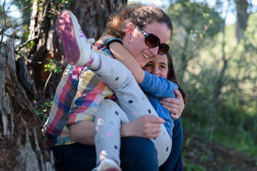 Fototapeta premium Mother and daughter playing in the field