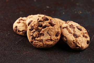 Chocolate cookies on wooden table. Chocolate chip cookies shot on table