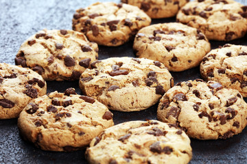 Chocolate cookies on wooden table. Chocolate chip cookies shot on table