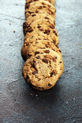 Chocolate cookies on wooden table. Chocolate chip cookies shot on table