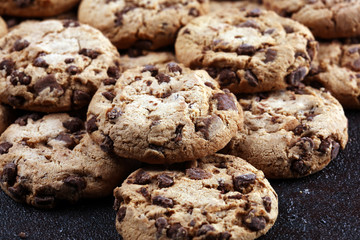 Chocolate cookies on wooden table. Chocolate chip cookies shot on table