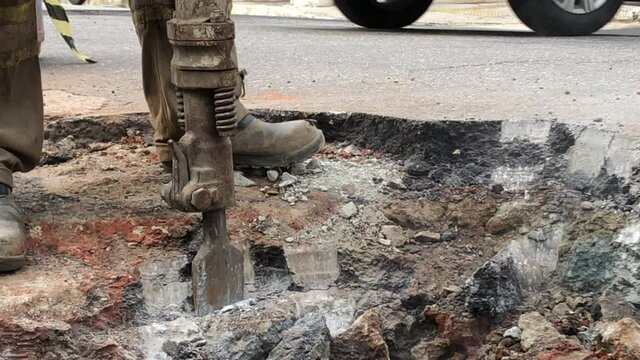 Building demolition jack hammer drill breaking concrete asphalt3