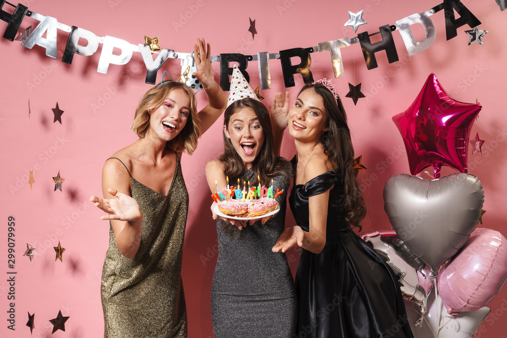 Sticker Image of beautiful party girls holding birthday cake with candles