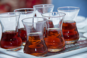 Tea in a armudu glass . armudu tea on tray . tea in a glass of pears inside the pod .