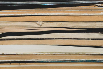Stack of old books close up background