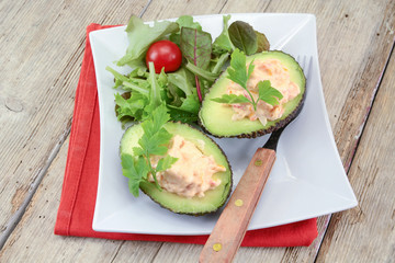 avocado with surimi and mayonnaise on a plate
