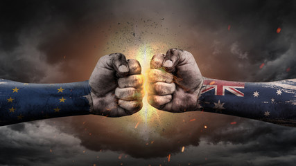 EU vs EU. Fists with flags. Battle EU with Australia on sky.