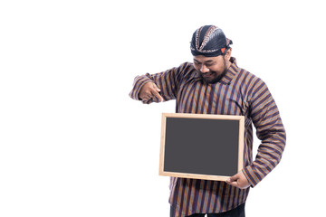 asian man with javanese traditional cloth lurik with blank board ready for your text