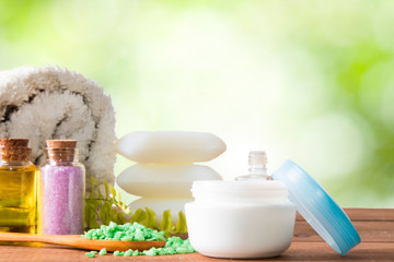 beauty products, mineral salts and body oils with natural background