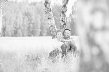 Fototapeta premium Loving family together in a park, field or woodlands