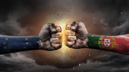 EU vs EU. Fists with flags. Battle EU with Portugal on sky.