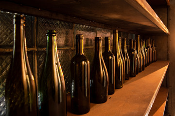 vine bottles on the wooden shelf