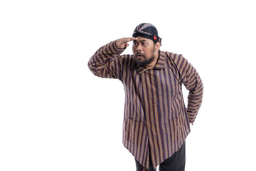 gesture of asian man with javanese traditional cloth lurik looking up for something
