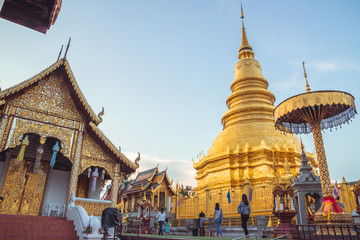 Fototapeta premium LAMPHUN,THAILAND - October 25 2019,Yi Peng Festival,Wat Phra That Hariphunchai,beautiful golden pagoda Lanna style