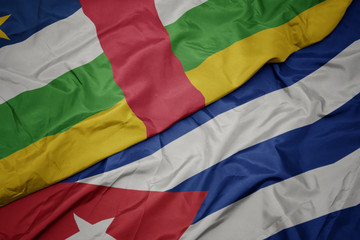 Fototapeta premium waving colorful flag of cuba and national flag of central african republic.