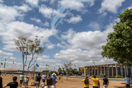 Brasilia, Brazil, October 29, 2019: Many people in Esplanade Ministries watching the smoke squad maneuver and stunt show. Independence Day of Brazil