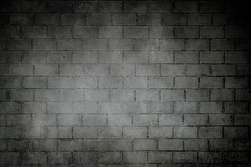 Fototapeta na wymiar Old dark bricks wall with dark vignette borders