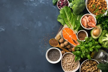 Tuinposter Eten Food sources of omega 3 on dark background with copy space top view. Foods high in fatty acids including vegetables, seafood, nut and seeds. Health food fitness