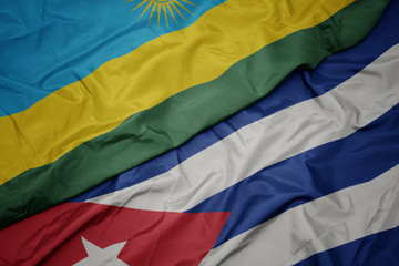 waving colorful flag of cuba and national flag of rwanda.