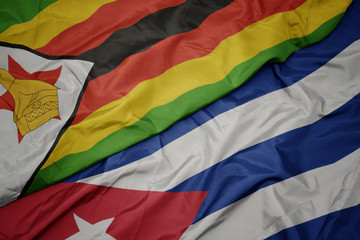 waving colorful flag of cuba and national flag of zimbabwe.