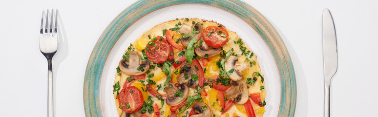 top view of plate with tasty omelet for breakfast on white table