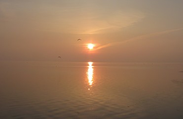 Naklejka premium impressive sunset over the sea on an autumn evening