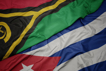 waving colorful flag of cuba and national flag of Vanuatu .